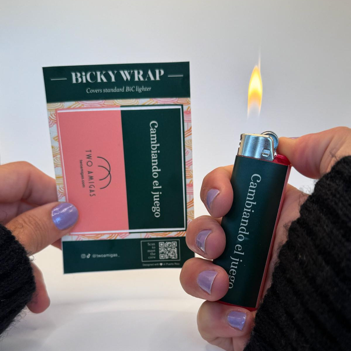 Person holding a Bicky Wrap product and a lighter with a visible brand name.